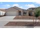 Charming single-story home featuring a two-car garage and low maintenance desert landscaping at 17791 W Getty Dr, Goodyear, AZ 85338