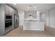 Spacious kitchen equipped with stainless steel appliances, large island, and ample cabinet space at 17791 W Getty Dr, Goodyear, AZ 85338
