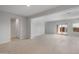 Bright and spacious living room area with neutral paint and tile flooring at 17791 W Getty Dr, Goodyear, AZ 85338