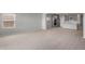Open-concept living area showcasing kitchen with island and stainless appliances at 17791 W Getty Dr, Goodyear, AZ 85338