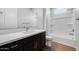 Well-lit bathroom featuring a sleek vanity, modern fixtures, and a shower-tub combination for everyday convenience at 18147 W Tanglewood Dr, Goodyear, AZ 85338