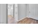 Inviting hallway leading to bathroom, showing modern design and seamless transition into living space at 18147 W Tanglewood Dr, Goodyear, AZ 85338