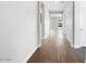 Long hallway features beautiful wood-look flooring and neutral paint at 18147 W Tanglewood Dr, Goodyear, AZ 85338