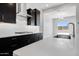 Bright kitchen featuring dark cabinets, subway tile backsplash, and modern stainless steel appliances at 18147 W Tanglewood Dr, Goodyear, AZ 85338