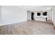 Bright living area showcasing wood flooring and a modern, open concept design at 18147 W Tanglewood Dr, Goodyear, AZ 85338