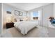 Bedroom featuring neutral colors, carpet flooring, natural light, and decorative artwork at 18147 W Tanglewood Dr, Goodyear, AZ 85338