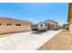Long driveway featuring RV parking leading to a well-maintained home with desert landscaping at 18543 W Denton Ave, Litchfield Park, AZ 85340