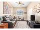 Additional living area features ceiling fan, neutral paint and comfortable seating at 18543 W Denton Ave, Litchfield Park, AZ 85340