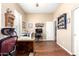 Bright office featuring hardwood floors, natural light, and a dedicated sewing station at 18543 W Denton Ave, Litchfield Park, AZ 85340