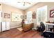 Well-lit office space with hardwood floors, a sewing station, and a bright, airy feel at 18543 W Denton Ave, Litchfield Park, AZ 85340