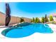 A sparkling pool surrounded by landscaping, offering a refreshing oasis and perfect for relaxation and outdoor enjoyment at 18543 W Denton Ave, Litchfield Park, AZ 85340
