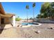 Enjoy a private backyard with a refreshing pool, desert landscaping, and covered patio at 2009 N 125Th Ave, Avondale, AZ 85392