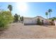 Spacious backyard with desert landscape, palm trees, and privacy fence at 2009 N 125Th Ave, Avondale, AZ 85392