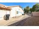 Exterior view of the home's side yard with landscaping, walkway, and storage shed at 2009 N 125Th Ave, Avondale, AZ 85392