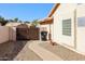 Exterior view of the home's side yard with gate, landscaping, and convenient walkway at 2009 N 125Th Ave, Avondale, AZ 85392