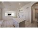 Bright, open kitchen with a center island, tiled floors, and views of the living area at 2009 N 125Th Ave, Avondale, AZ 85392