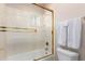 Bathroom featuring a shower and toilet enclosure and a towel rack with white towels at 20802 N Grayhawk Dr # 1005, Scottsdale, AZ 85255