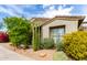 Landscaped front yard with desert plants and native vegetation create inviting curb appeal at 20802 N Grayhawk Dr # 1005, Scottsdale, AZ 85255