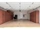 Spacious two car garage with ample storage cabinets and epoxy flooring creating an organized area at 20802 N Grayhawk Dr # 1005, Scottsdale, AZ 85255