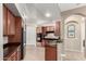 Modern kitchen with stainless steel appliances and rich wood cabinetry and dark countertops at 20802 N Grayhawk Dr # 1005, Scottsdale, AZ 85255