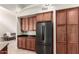 This modern kitchen features updated wood cabinets and stainless steel appliances at 20802 N Grayhawk Dr # 1005, Scottsdale, AZ 85255