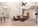 Inviting living room showcasing tile flooring, high ceilings, and an archway to another room at 20802 N Grayhawk Dr # 1005, Scottsdale, AZ 85255