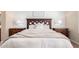 Comfortable main bedroom featuring a large bed, side tables, and decorative artwork at 20802 N Grayhawk Dr # 1005, Scottsdale, AZ 85255