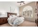 Bright main bedroom with large windows, a ceiling fan, and soft neutral decor at 20802 N Grayhawk Dr # 1005, Scottsdale, AZ 85255