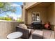 Cozy outdoor patio with comfortable seating, a grill and a chiminea, perfect for relaxing at 20802 N Grayhawk Dr # 1005, Scottsdale, AZ 85255