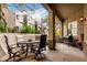 Inviting covered patio with an outdoor seating area, grill and chiminea, ideal for entertaining at 20802 N Grayhawk Dr # 1005, Scottsdale, AZ 85255