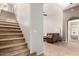Carpeted staircase leading to the second floor with a view into the downstairs living area at 20802 N Grayhawk Dr # 1005, Scottsdale, AZ 85255