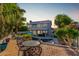 Inviting backyard with a pool, patio, and mature landscaping creates an outdoor oasis at 21121 N 63Rd Dr, Glendale, AZ 85308