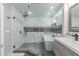 Luxurious bathroom featuring a glass-enclosed shower with dual showerheads, a soaking tub, and modern fixtures at 21121 N 63Rd Dr, Glendale, AZ 85308