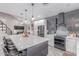 Modern kitchen features a large island, stainless steel appliances, and sleek cabinetry at 21121 N 63Rd Dr, Glendale, AZ 85308