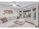 Comfortable living room with a large sectional sofa and bay window at 21121 N 63Rd Dr, Glendale, AZ 85308