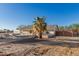 The exterior back of the home with desert landscaping and outdoor sitting, ideal for enjoying the serene surroundings at 22324 W Magnolia St, Buckeye, AZ 85326