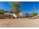 Exterior shot of the barn with trees around, a functional addition to the property at 22324 W Magnolia St, Buckeye, AZ 85326