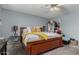 Simple bedroom with a ceiling fan, neutral walls, and a large bed at 22324 W Magnolia St, Buckeye, AZ 85326