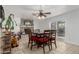 Charming dining area featuring a brick fireplace, tile floors, and sliding glass doors at 22324 W Magnolia St, Buckeye, AZ 85326