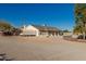 Ranch home exterior with a carport and a neutral color palette, showcasing its simple design at 22324 W Magnolia St, Buckeye, AZ 85326