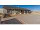 Single-story home with front concrete parking and seating area for enjoying the outdoors at 22324 W Magnolia St, Buckeye, AZ 85326