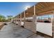 Sturdy, covered horse stalls featuring concrete construction and ample space, ready for equestrian use at 22324 W Magnolia St, Buckeye, AZ 85326