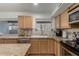 Kitchen featuring an undermount sink, stainless steel appliances, and tile backsplash at 22324 W Magnolia St, Buckeye, AZ 85326
