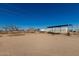 Expansive property featuring a storage container and open space perfect for customization and outdoor activities at 22324 W Magnolia St, Buckeye, AZ 85326