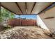 Open shed with a concrete floor and metal roof, providing ample space for storage or workshop activities at 22324 W Magnolia St, Buckeye, AZ 85326