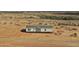 New build home showing gray exterior, complementing the tranquil desert scenery at 23139 W Duane Ln, Wittmann, AZ 85361