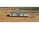 New build home featuring a gray exterior, complementing the tranquil desert landscape at 23139 W Duane Ln, Wittmann, AZ 85361