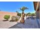 Landscaped backyard with seating and a beautiful desert landscape at 2384 E Santiago Trl, Casa Grande, AZ 85194