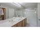 Bright bathroom with double vanity sinks, walk-in shower and great lighting at 2384 E Santiago Trl, Casa Grande, AZ 85194