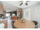 Open dining area with wood table and stainless steel appliances in a modern kitchen at 2384 E Santiago Trl, Casa Grande, AZ 85194